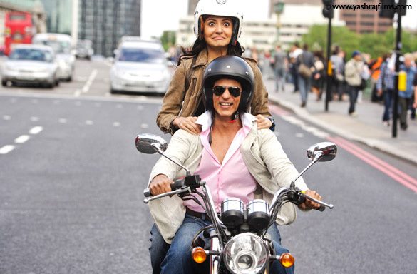 Shahrukh khan and Anushka Sharma riding a bike with helmets from their movie - London Ishq - Shah Rukh and Anushka - London Ishq Stills : Movies, Parties