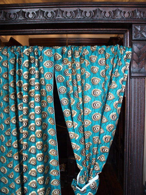 These wax print drapes are sure to dress up any window AND wall in your home, whether that be your bedroom, living, room, nursery, or home office. In addition to 100% cotton wax print fabrics, window treatments are made with a special lining to prevent fading and increase privacy and protection from the sun. Shown above in Peacock PLUME, and KILIFI Waves
