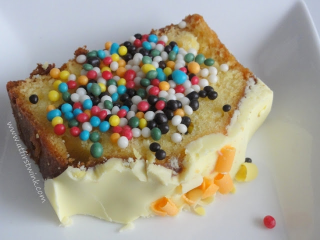 a slice of lemon fudge cake with colorful sprinkles on top