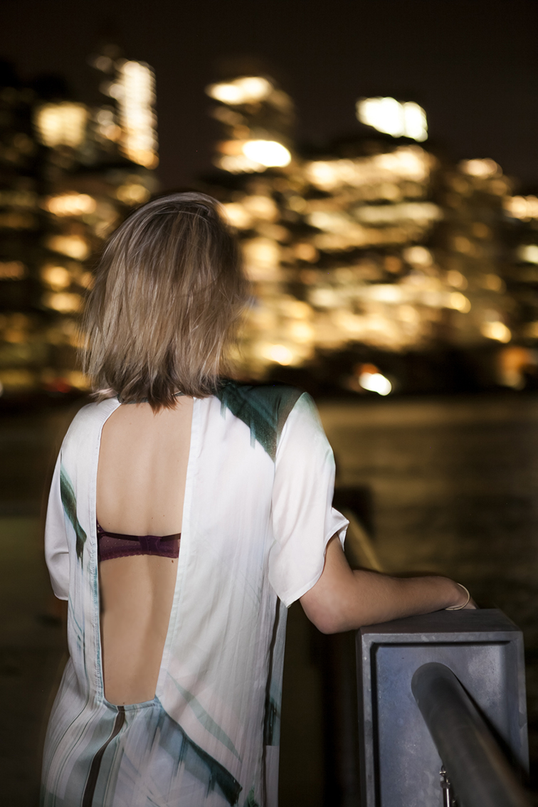 Stefanie Biggel backless Prime dress, blond messy bob, nighttime photography, East River, NYC