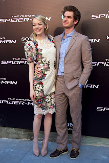 Emma Stone and Andrew Garfield posing together on the red carpet 