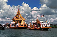 Five Buddha images are carried on royal ceremonial barges