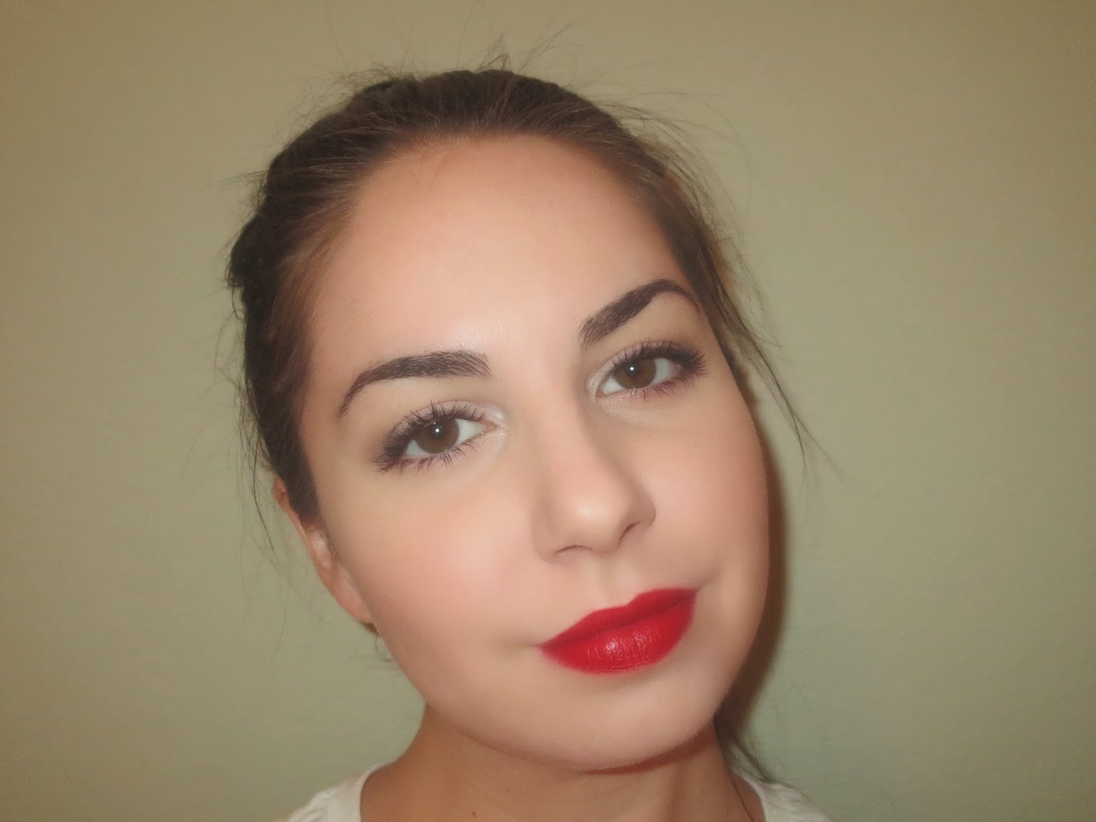 a picture of a classic black liner red lip makeup look