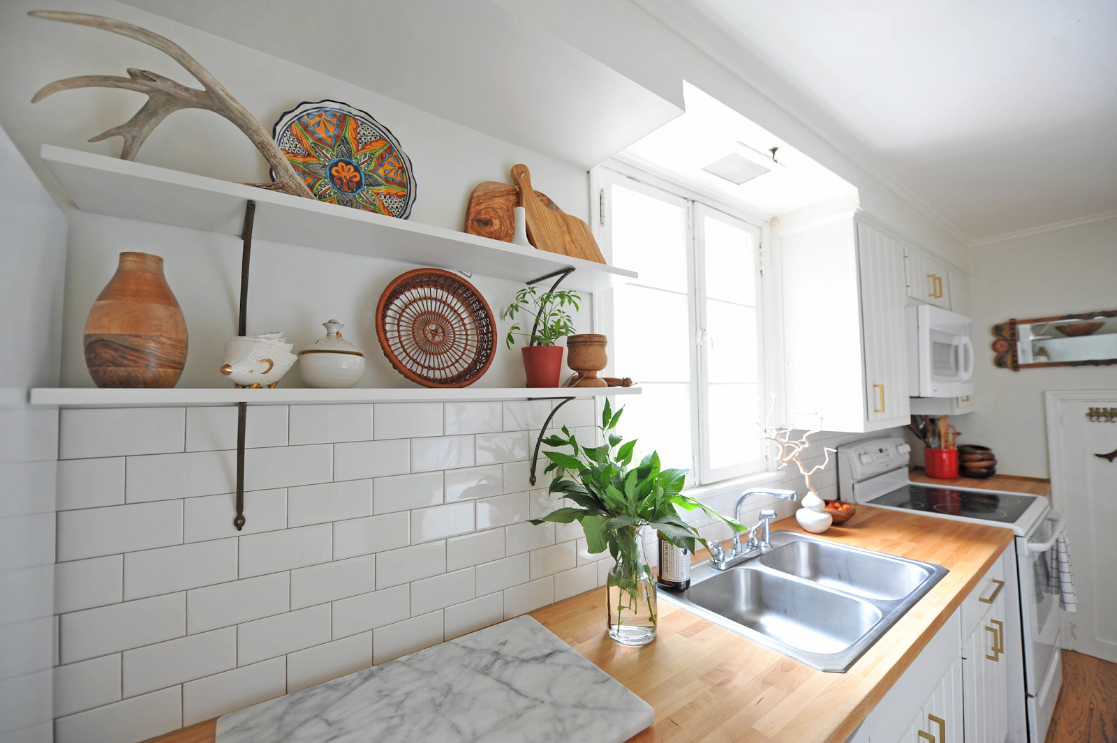 Modern White Eclectic Kitchen DIY Renovation ntropologie bracket Butcher block countertop