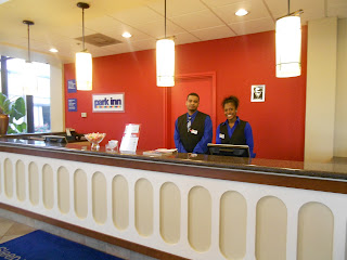 a man and woman standing behind a counter