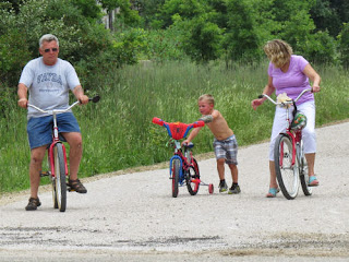 family bicycling the Pere Marquette Trail