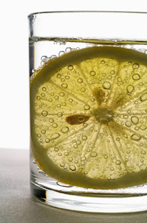 glass of sparkling water with lemon slice