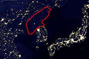  with neighboring countries. north korea south korea at night