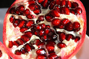 Autumn Treats. Delicious Organic Pomegranate (pomegranate fruit cut)