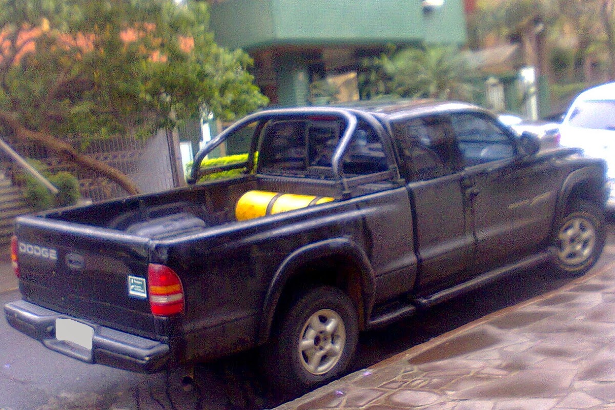 A few trucks converted to bifuel gasoline/CNG in my hometown Fuel