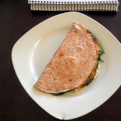 Spanakopita Quesadilla:  A fusion of Mexican and Greek cuisines.  Spinach, feta, and mozzarella packed into a whole wheat tortilla and fried.