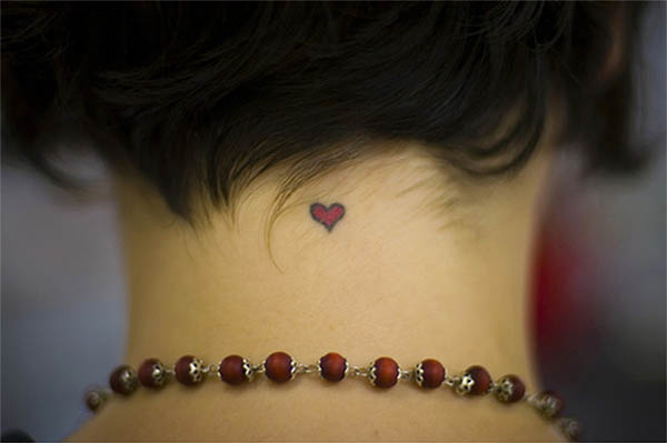 small heart neck tattoo