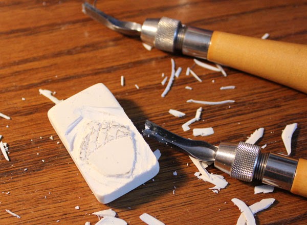 carving an acorn stamp from a white eraser carving an acorn stamp from a white eraser
