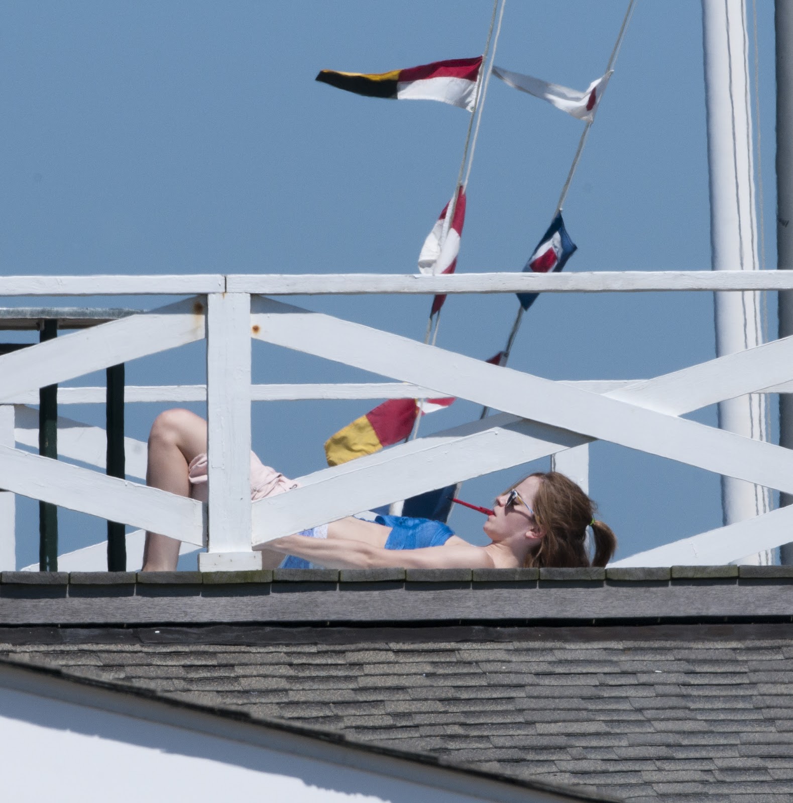 Celebrity Candids: Emma Watson - laying out in her 