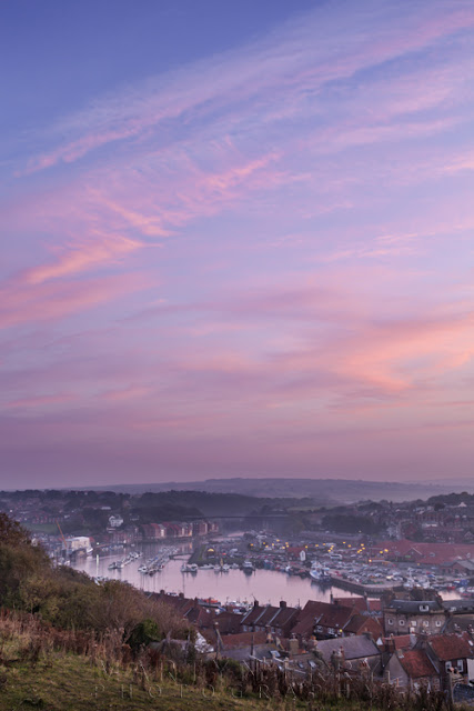 Image of Whitby town and harbour at sunset by Martyn Ferry Photography
