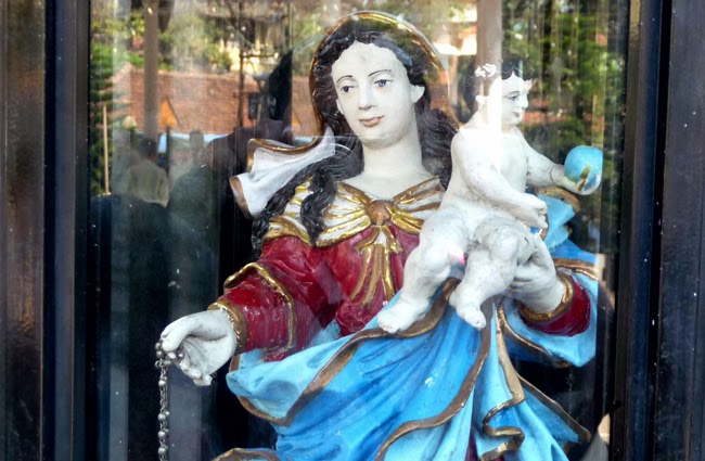 Our Lady of Rosary statue at the foot of the church