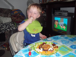 Enjoying his Mama's Cooking!