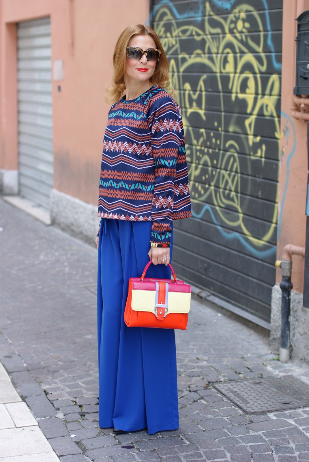 Colorful outfit with wide leg palazzo pants and Paula Cademartori Petite Faye bag on Fashion and Cookies fashion blog, fashion blogger style