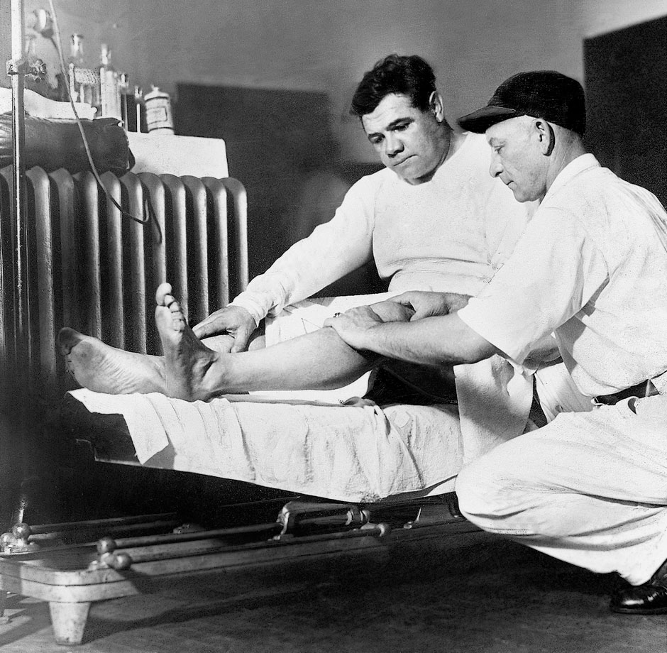 Doc Woods attends to Babe's swollen knee