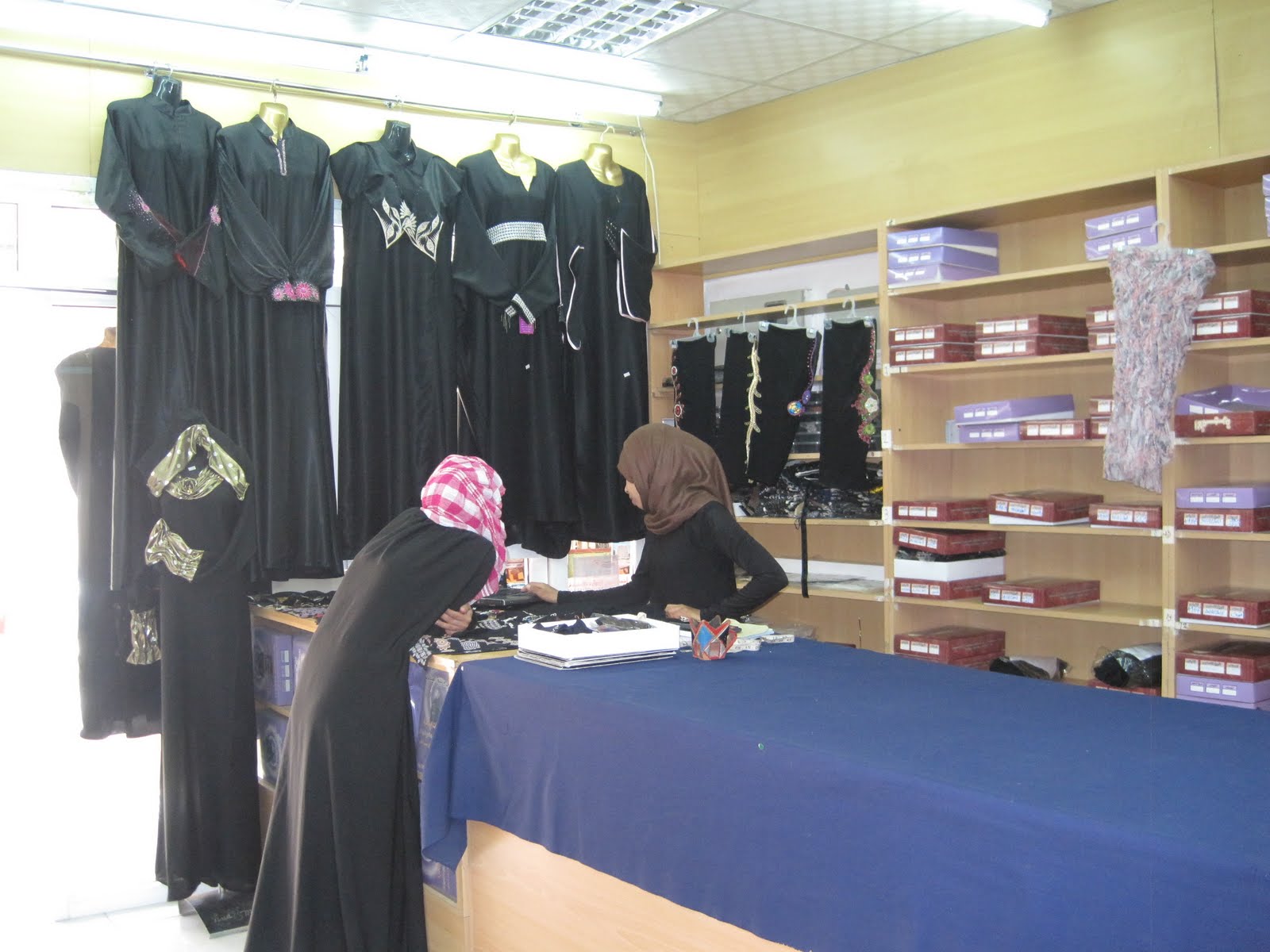 Reflections from Lee & Kitty Women's dress in Oman