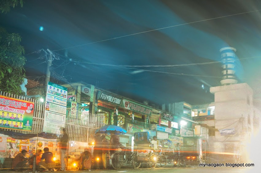  Night view of Naogaon bridge mor with the Town Mosque in the back.