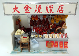 Front of a modern dolls' house miniature Hong Kong roast meat shop.