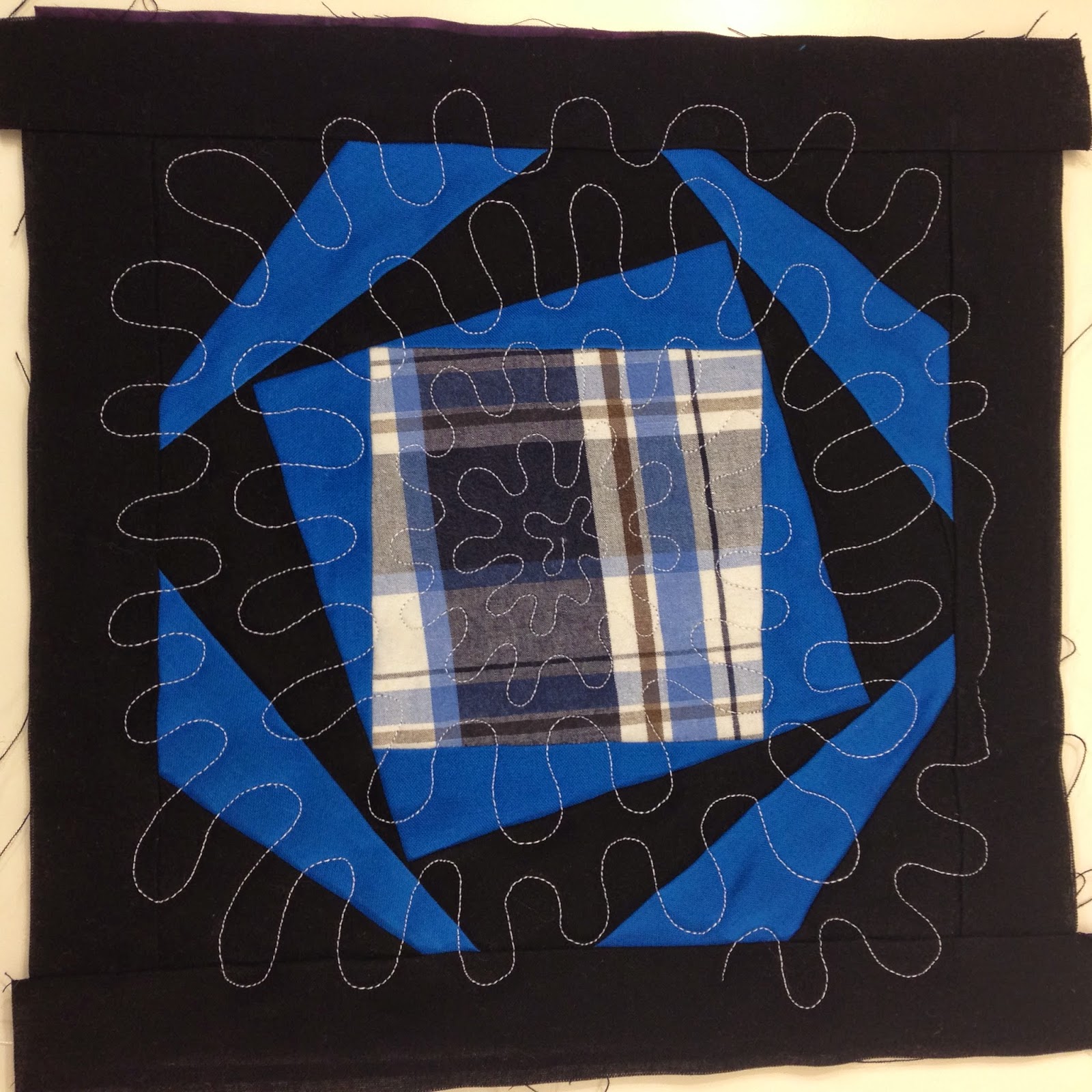 Leah's wiggly spirals in a spinning square block