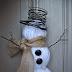 Make a snowman with yarn wrapped foam balls