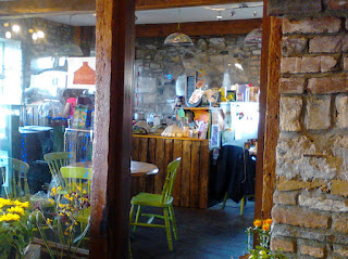 Budding Cafe, entrance to the florists and cafe, showing the counter and a lime-green painted chair