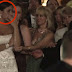 The groom kisses this woman in front of the bride. As she sees, she is weeping.