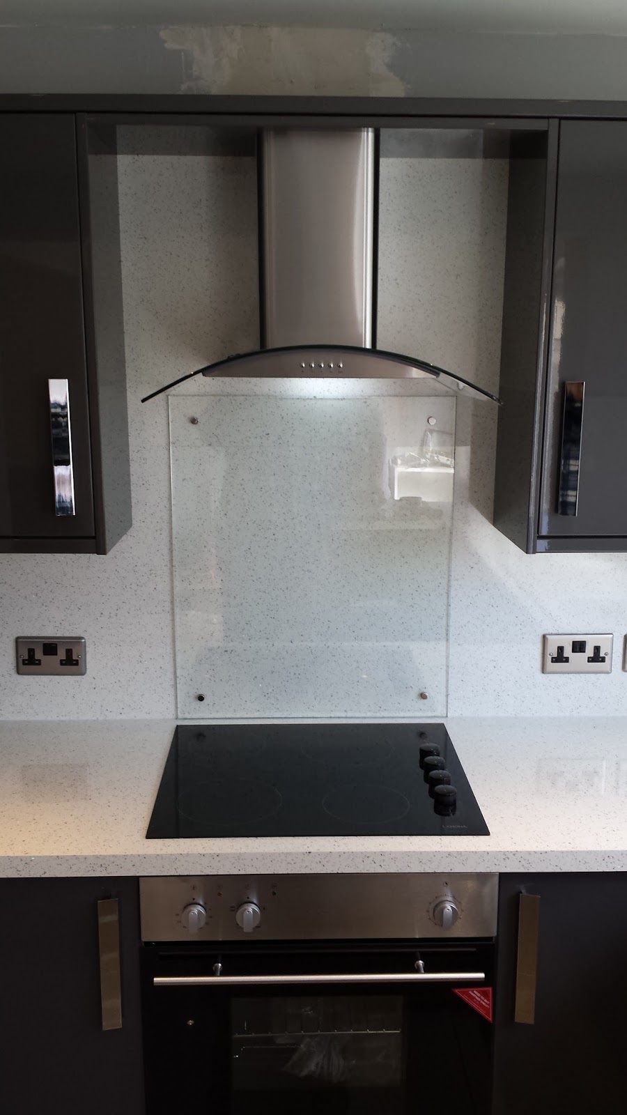 Elm Kitchens and Joinery Howdens Kitchen in dark grey gloss with a