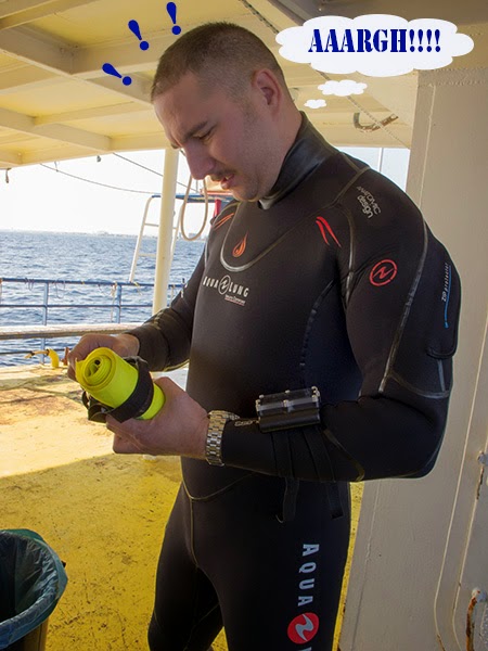 diver tries to prepare yellow dsmb