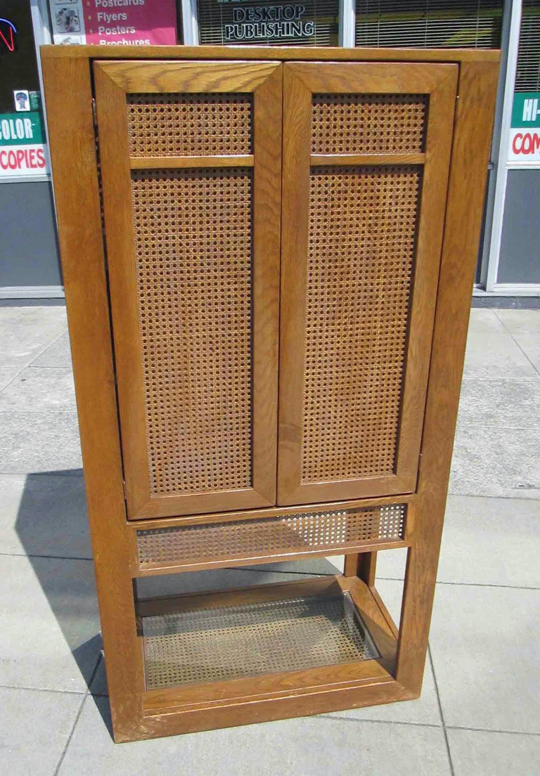 UHURU FURNITURE & COLLECTIBLES SOLD Armoire with Cane and Glass Accents 95