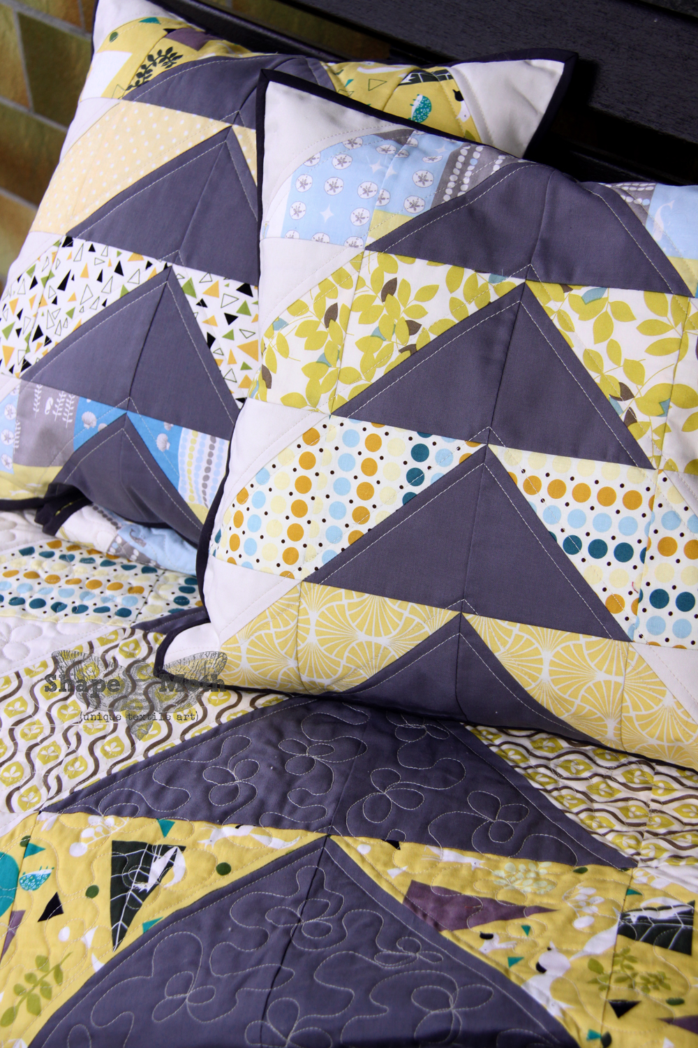 Shape Moth 'Hillside' lap quilt