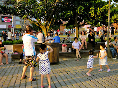 Kids playing around Tamsui Pier at Sunset Taiwan