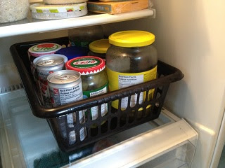 So I grabbed a basket that I had bought at the Dollar Store, filled it up with all the jarred stuff that gets forgotten, and put it back in the fridge.