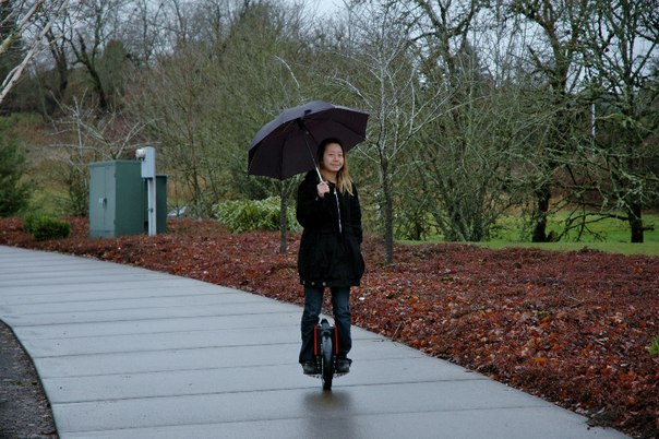 Image result for riding electric unicycle with umbrella