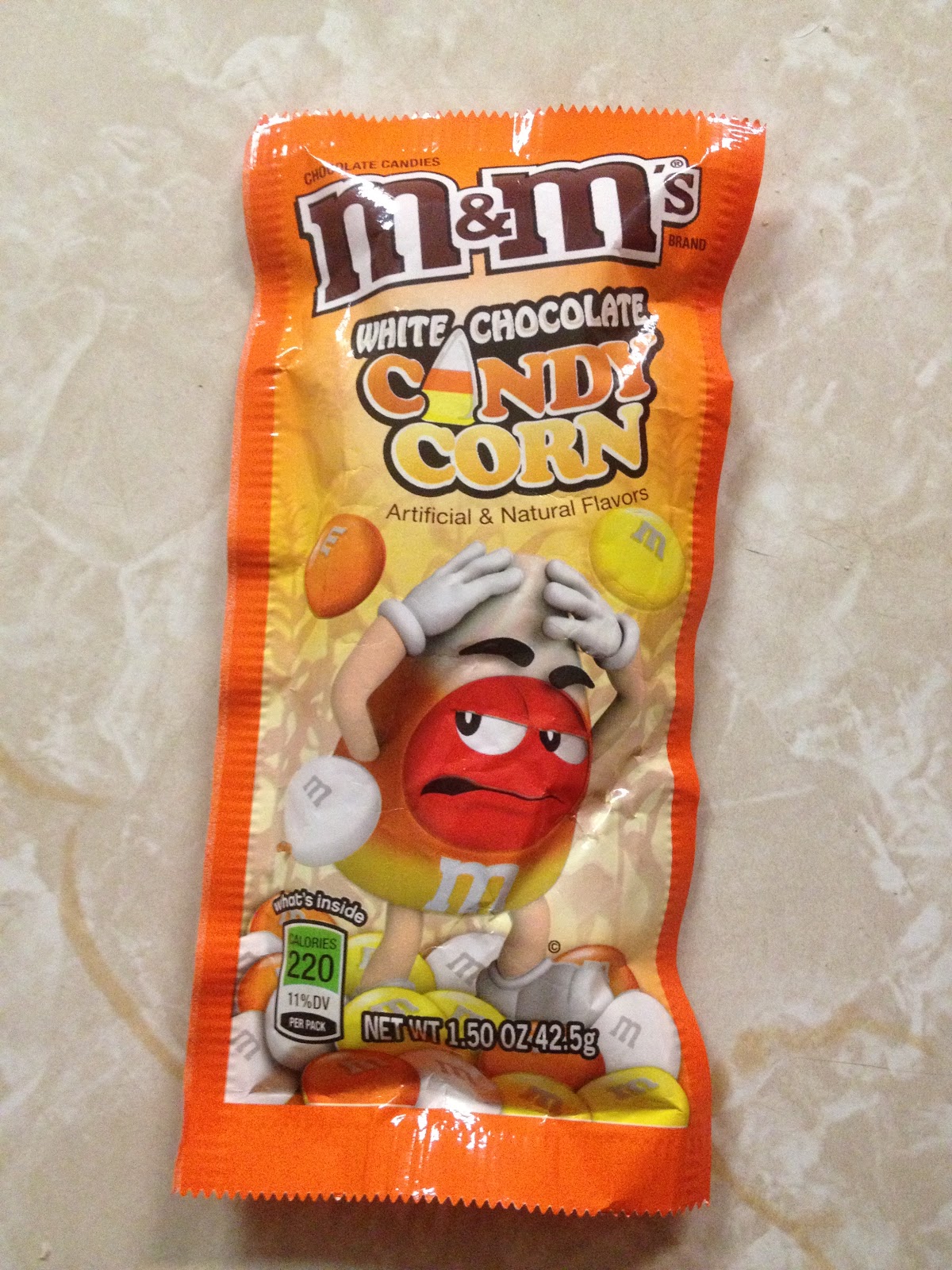 step off Candy Corn M&Ms