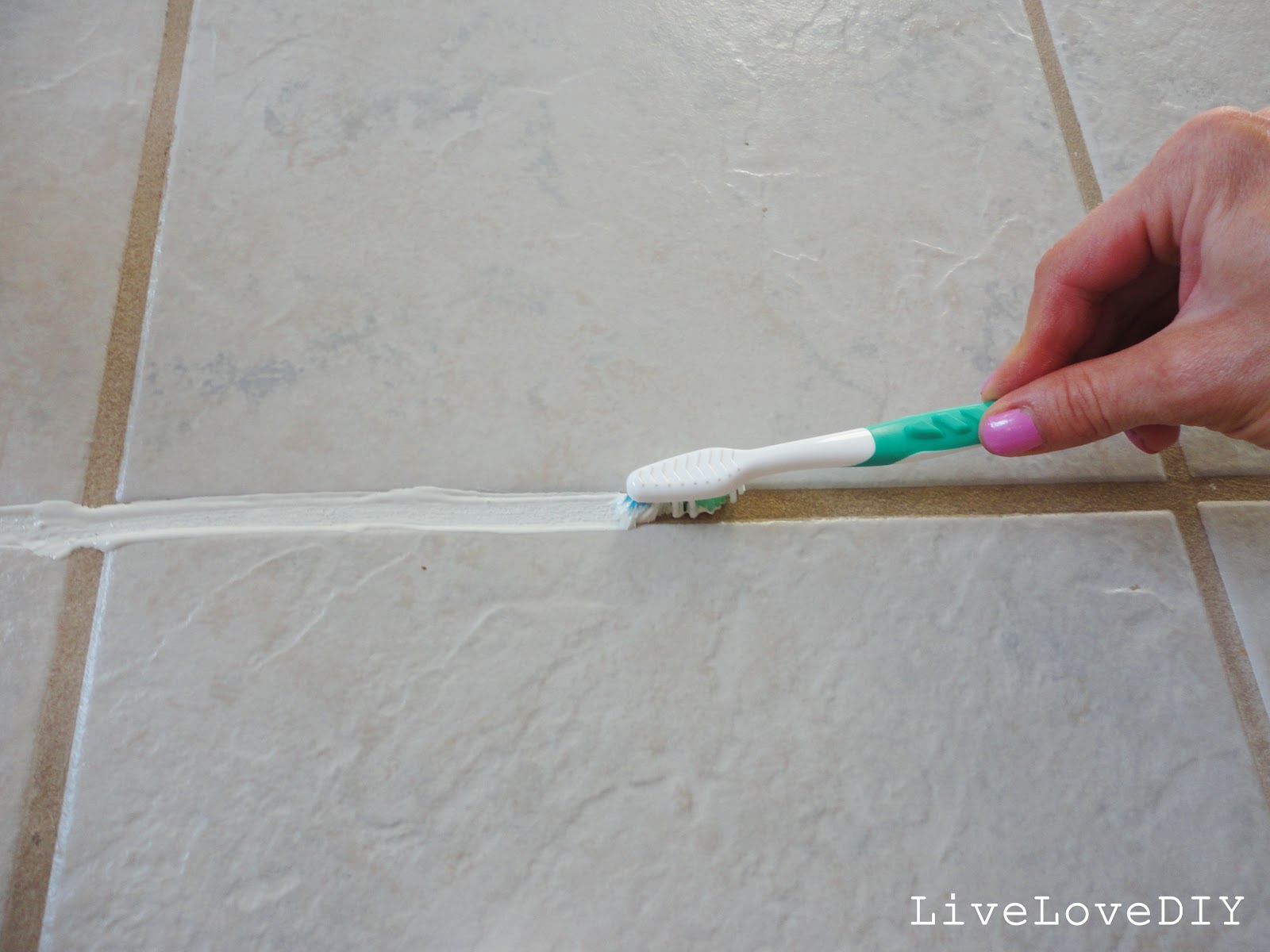 Use an old toothbrush to clean up the grout.