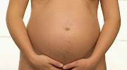 Women taking a multivitamin tablet can increase your chances of getting . (px pregnant belly button)