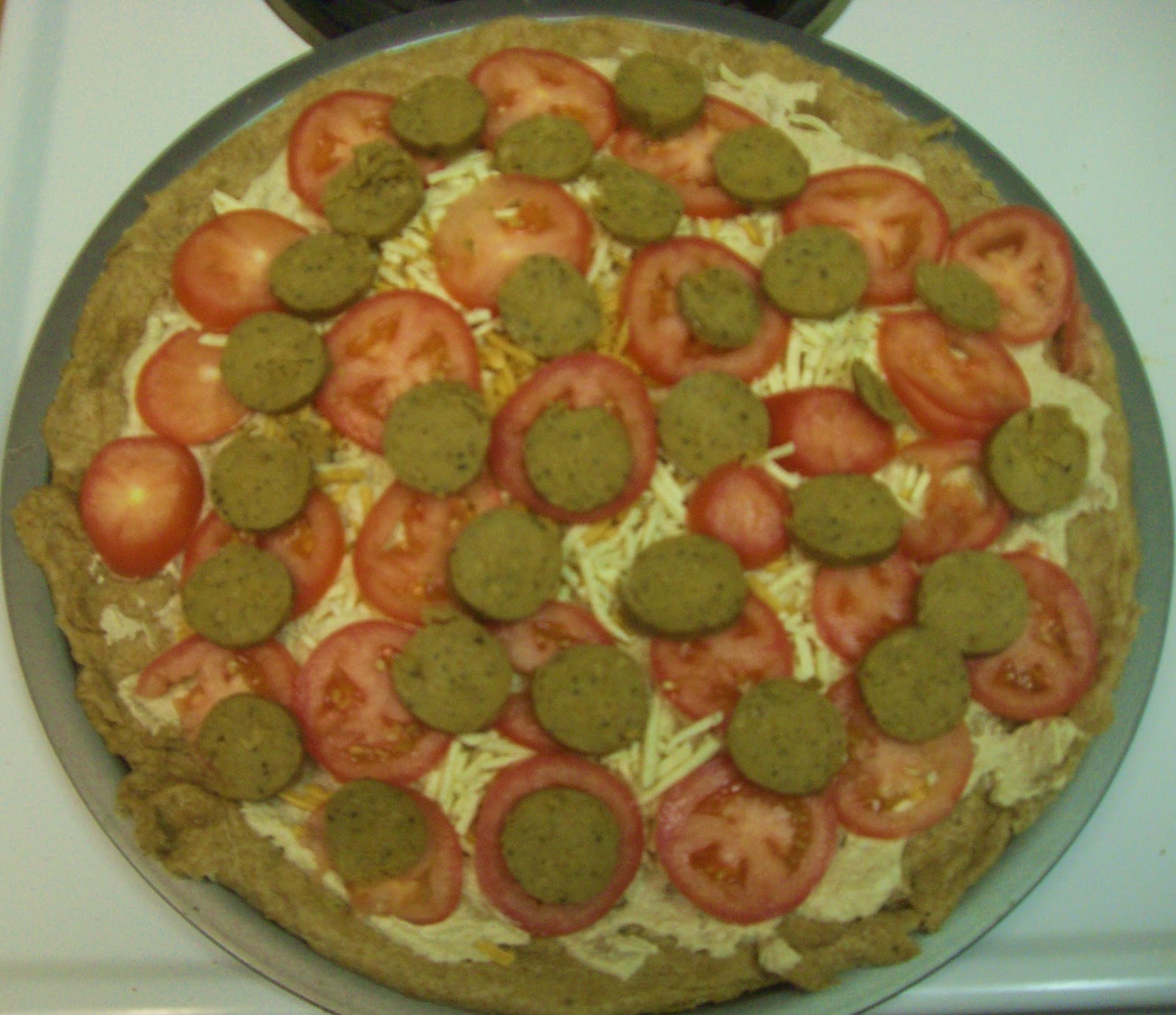 AfroVeganChick Cauliflower Walnut Cream Pizza Topped With Daiya