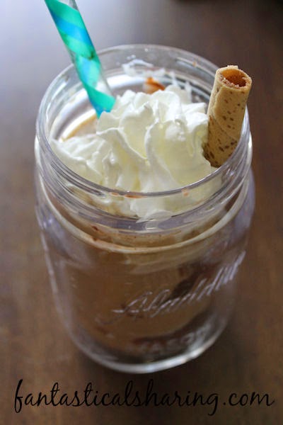 Chocolate Hazelnut Coffee | Delicious iced coffee with #Nutella and whipped cream and a hazelnut cookie wafer to top it off. #recipe