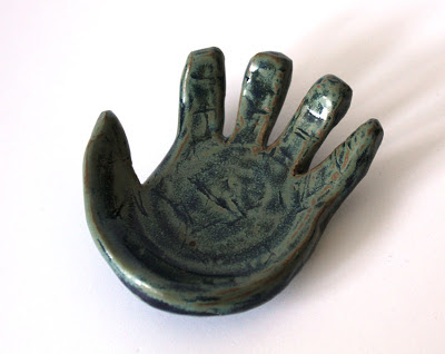 carved pottery hand shaped plate