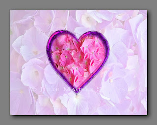 A card of flower petals in the shape of a pink heart.