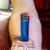 3D BLUE LIGHTER WITH INK TATTOO ON HAND