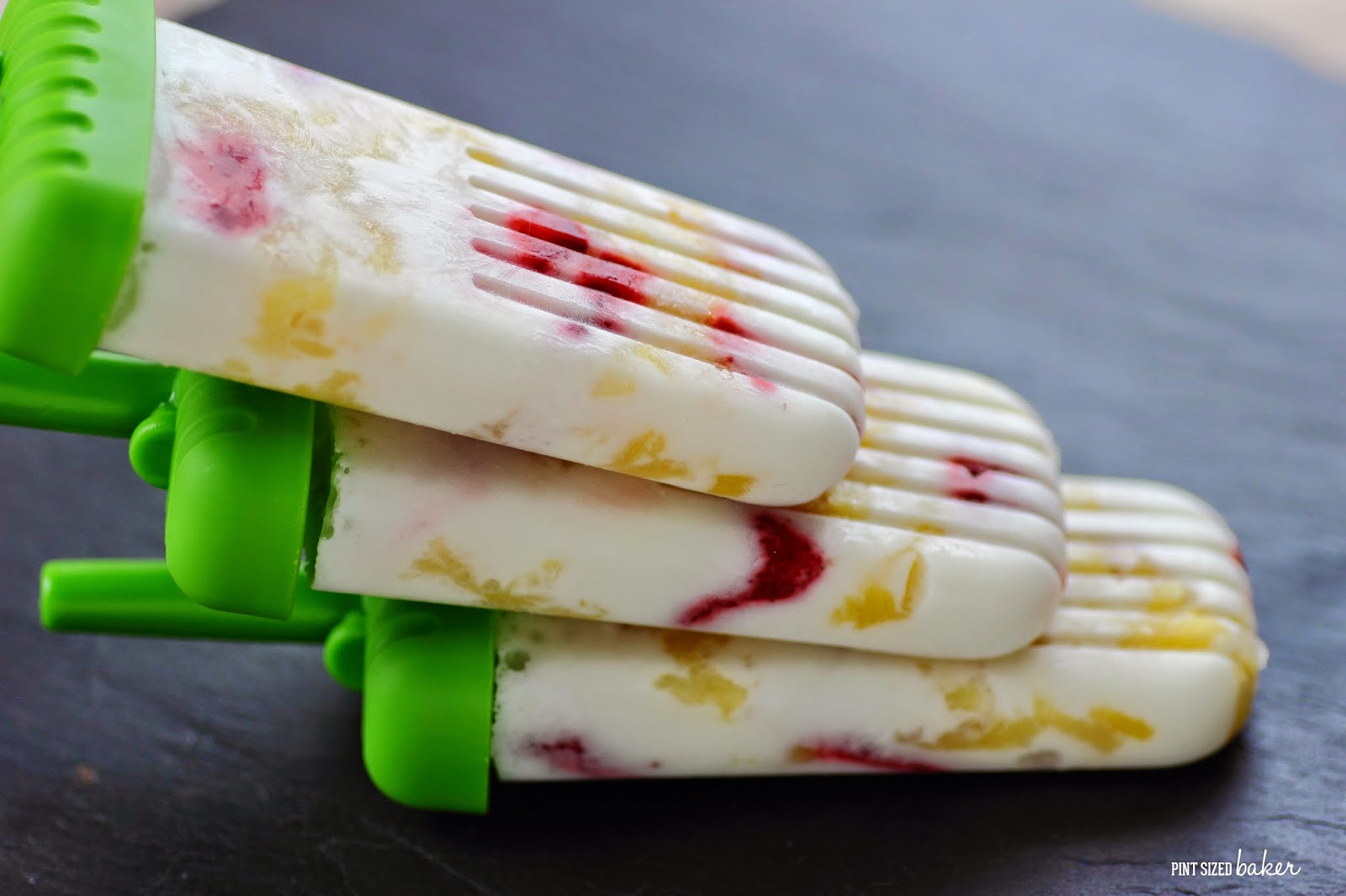 Kids young and old can make and enjoy these Pineapple Strawberry Coconut Popsicles Real, simple ingredients that are dairy free and naturally gluten free.