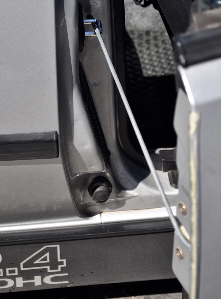 Just A Car Guy a door prop rod that limits the swing so your doors are