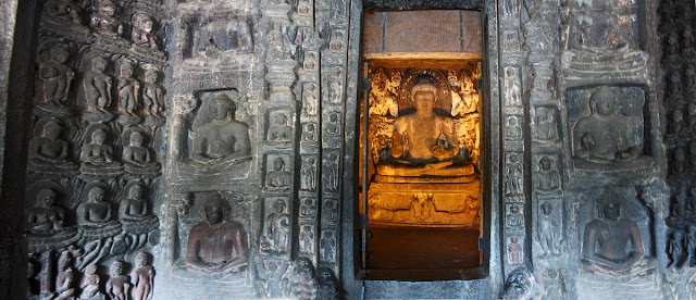 buddha in the inner sanctum surrounded by small Buddhas