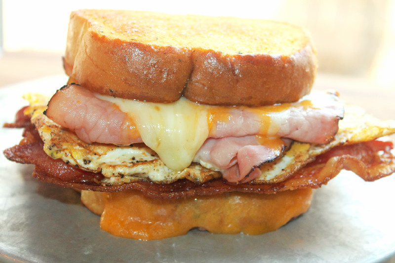 Creole Contessa Texas Size Breakfast Sandwich with Bacon, Egg, Ham