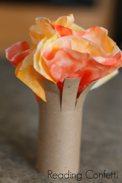 Fall tree craft for kids made from an empty cardboard tube and coffee filters